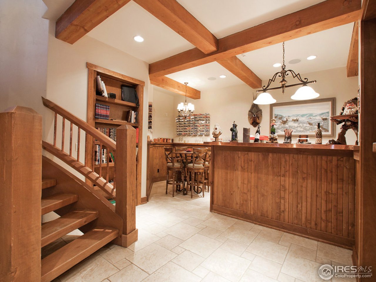 7654 Spirit Ranch Road Golden, CO 80403 - Photo 19 of 25 a view of a living room and a kitchen with furniture