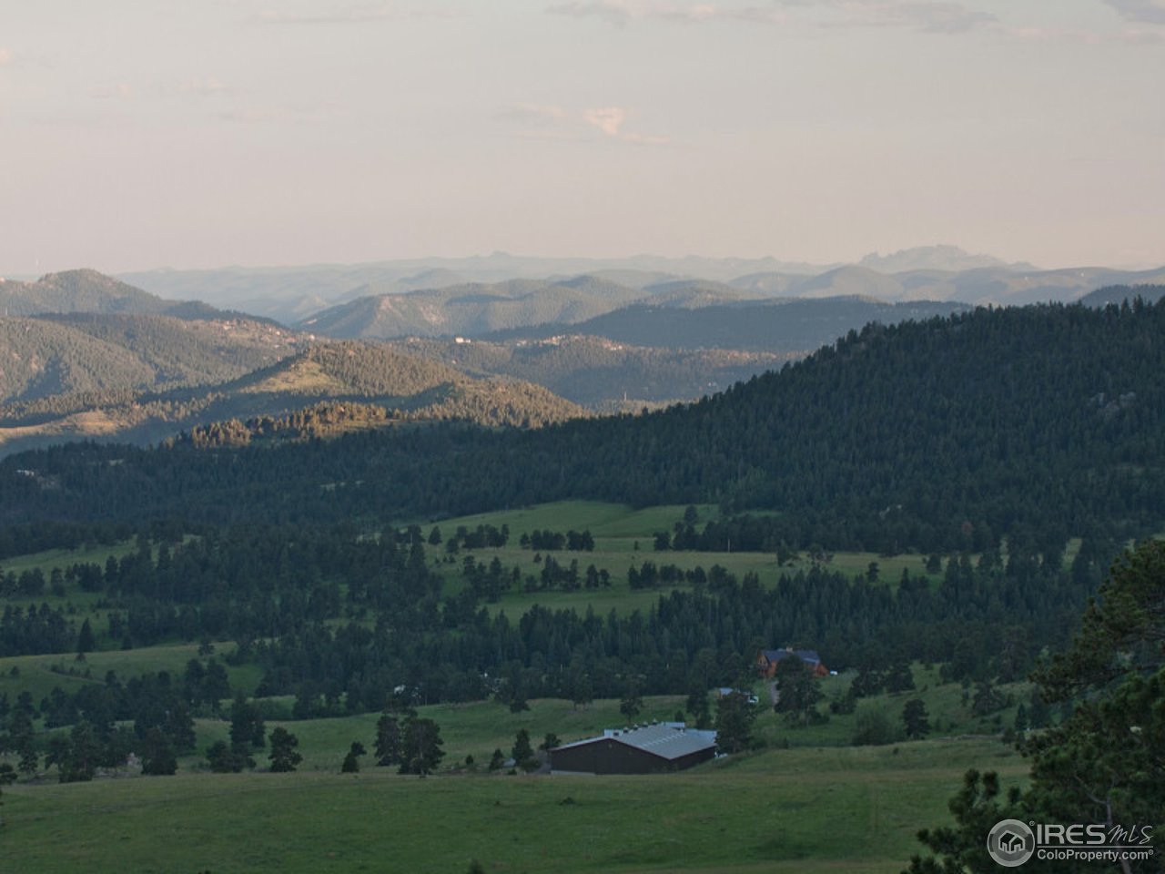 7654 Spirit Ranch Road Golden, CO 80403 - Photo 24 of 25 an aerial view of a house with a yard and mountain view in back