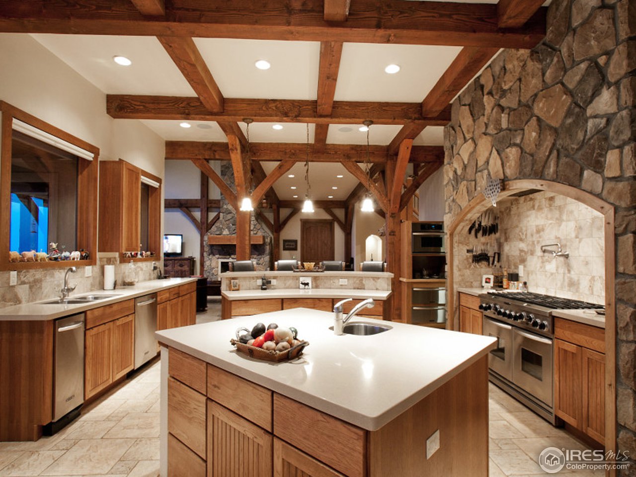 7654 Spirit Ranch Road Golden, CO 80403 - Photo 8 of 25 a kitchen with a sink and stove