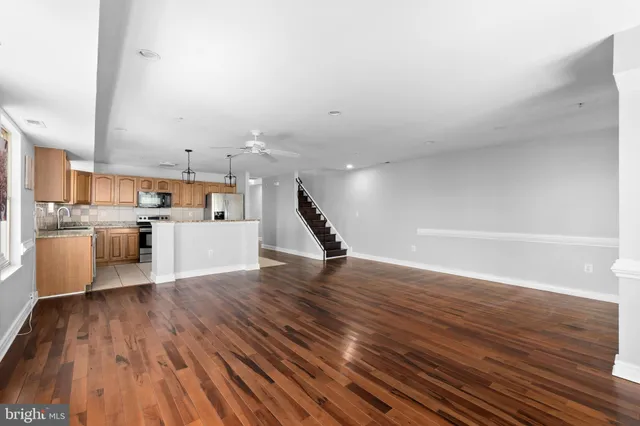 a view of a kitchen with microwave and cabinets