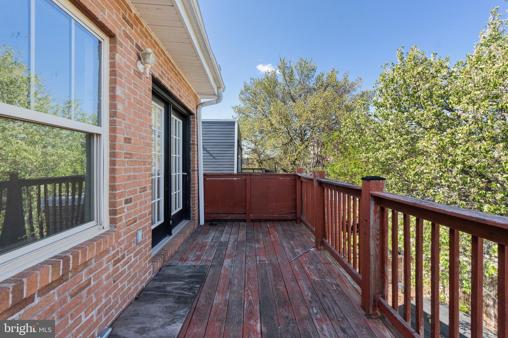 1829 Providence Street Northeast, Unit A Washington, DC 20002 - Photo 14 of 38 a view of balcony with wooden floor and fence