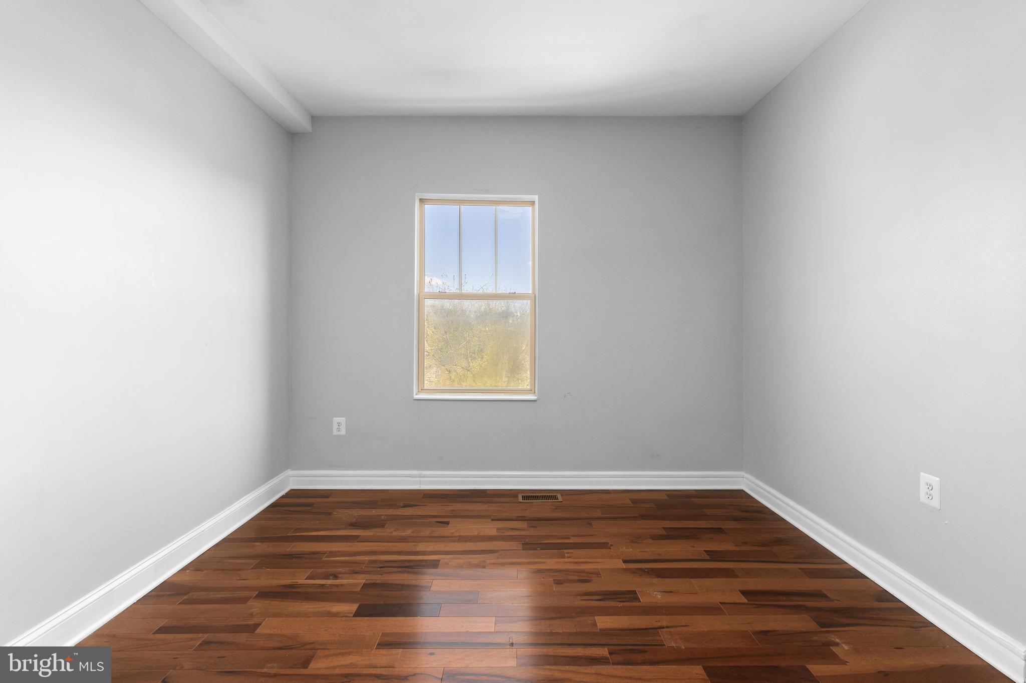 1829 Providence Street Northeast, Unit A Washington, DC 20002 - Photo 16 of 38 a view of wooden floor and windows in a room