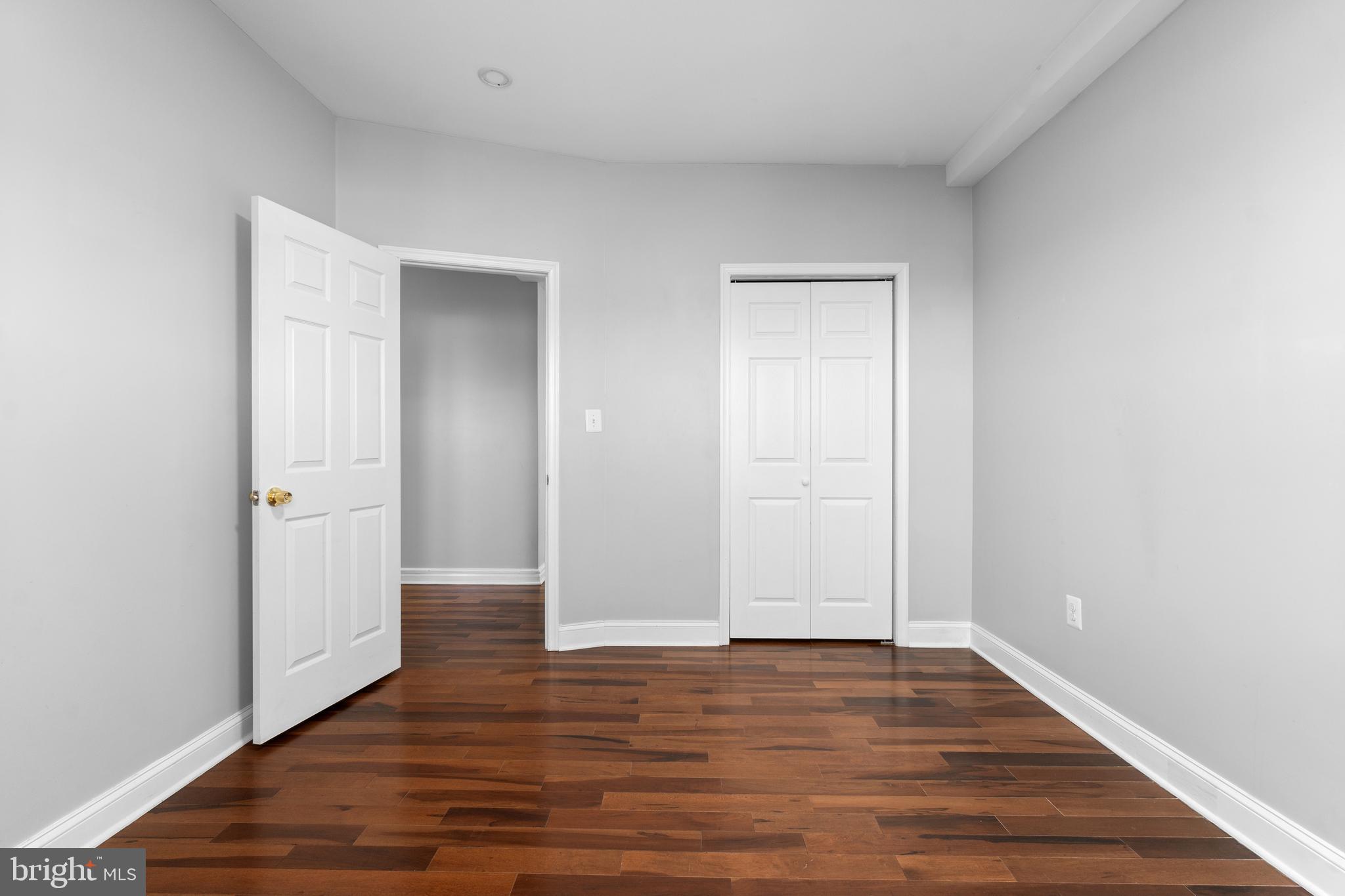 1829 Providence Street Northeast, Unit A Washington, DC 20002 - Photo 17 of 38 a view of an empty room with wooden floor