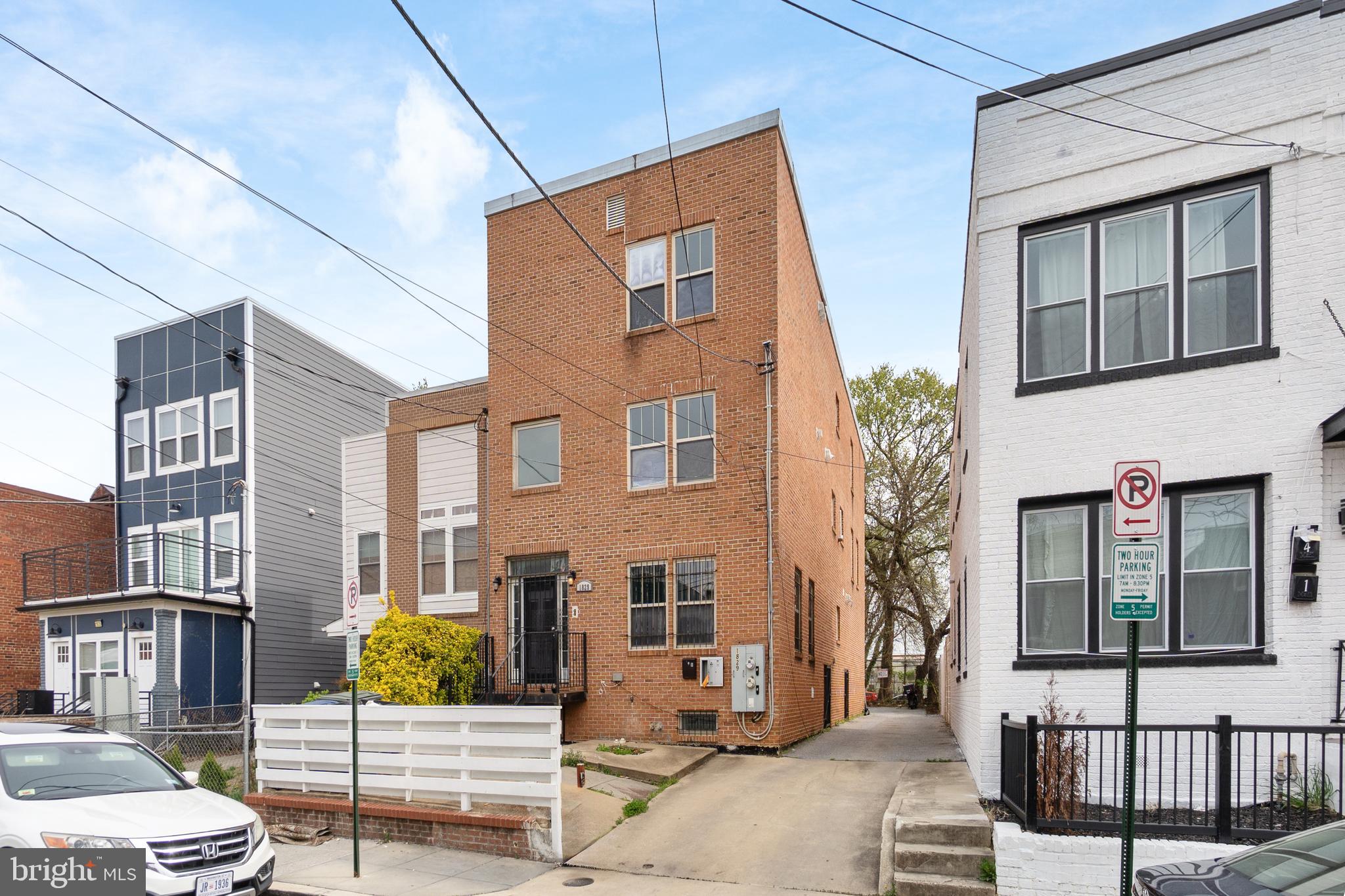 1829 Providence Street Northeast, Unit A Washington, DC 20002 - Photo 2 of 38 a front view of a house with a garden