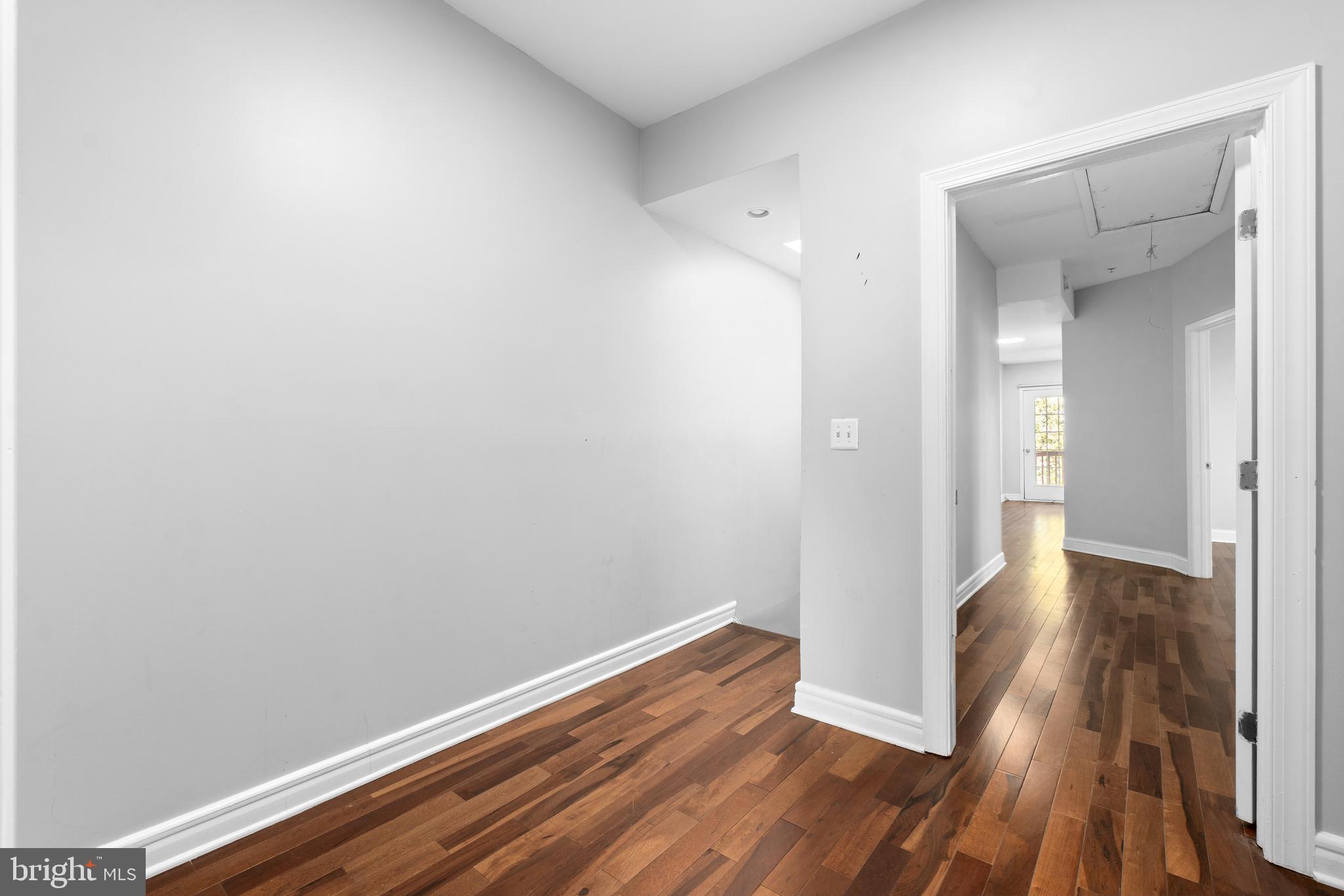 1829 Providence Street Northeast, Unit A Washington, DC 20002 - Photo 19 of 38 a view of hallway with wooden floor