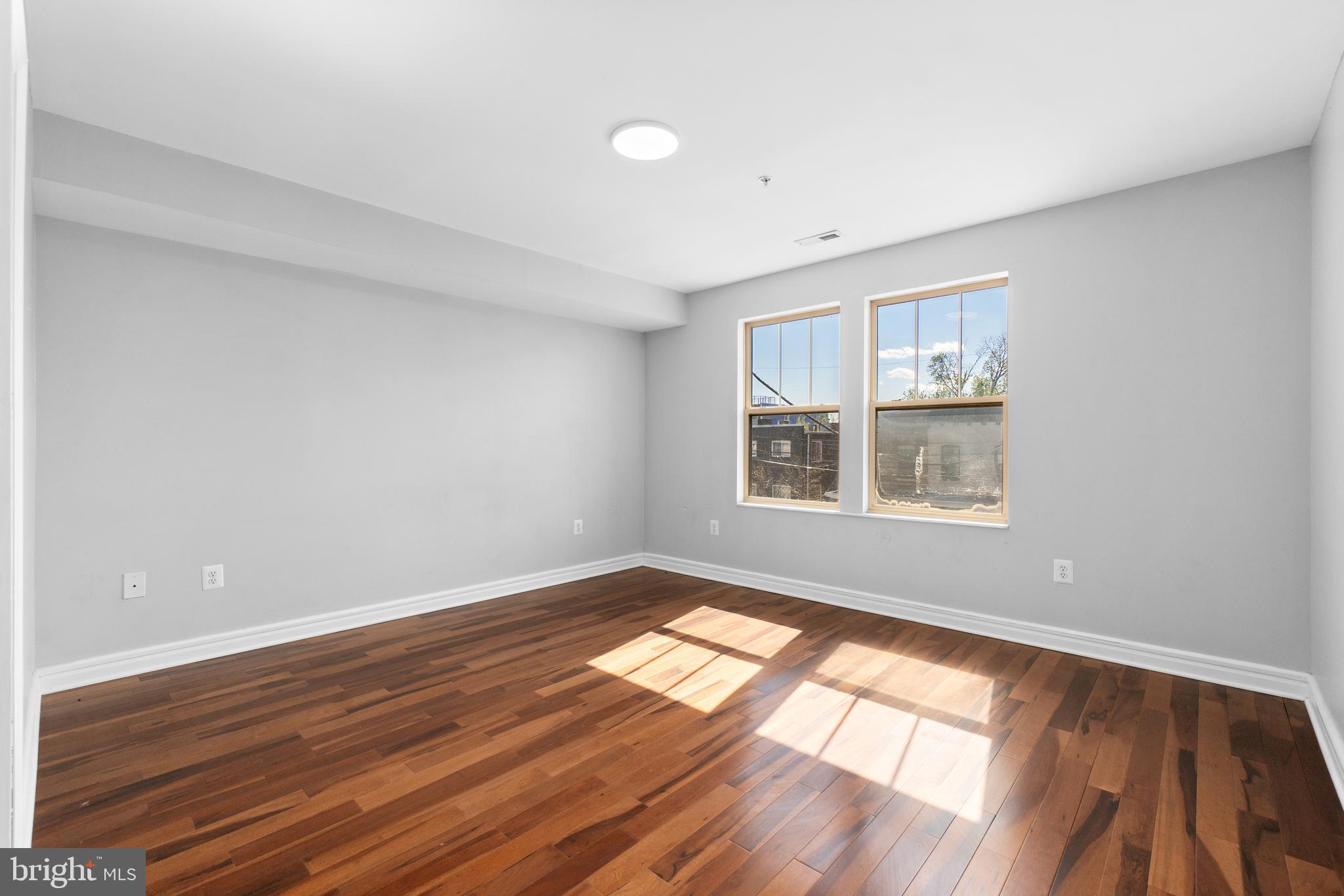 1829 Providence Street Northeast, Unit A Washington, DC 20002 - Photo 20 of 38 wooden floor in an empty room with a window