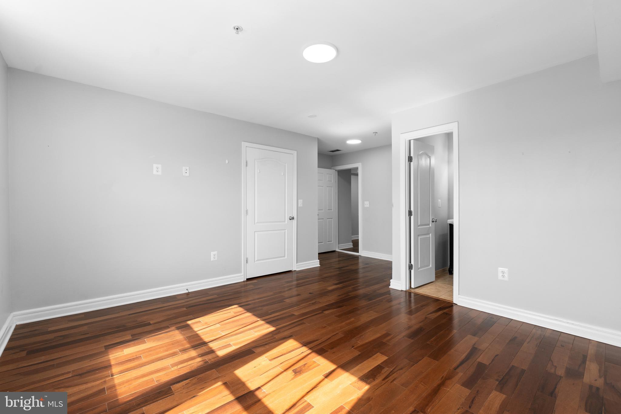 1829 Providence Street Northeast, Unit A Washington, DC 20002 - Photo 26 of 38 a view of an empty room and wooden floor