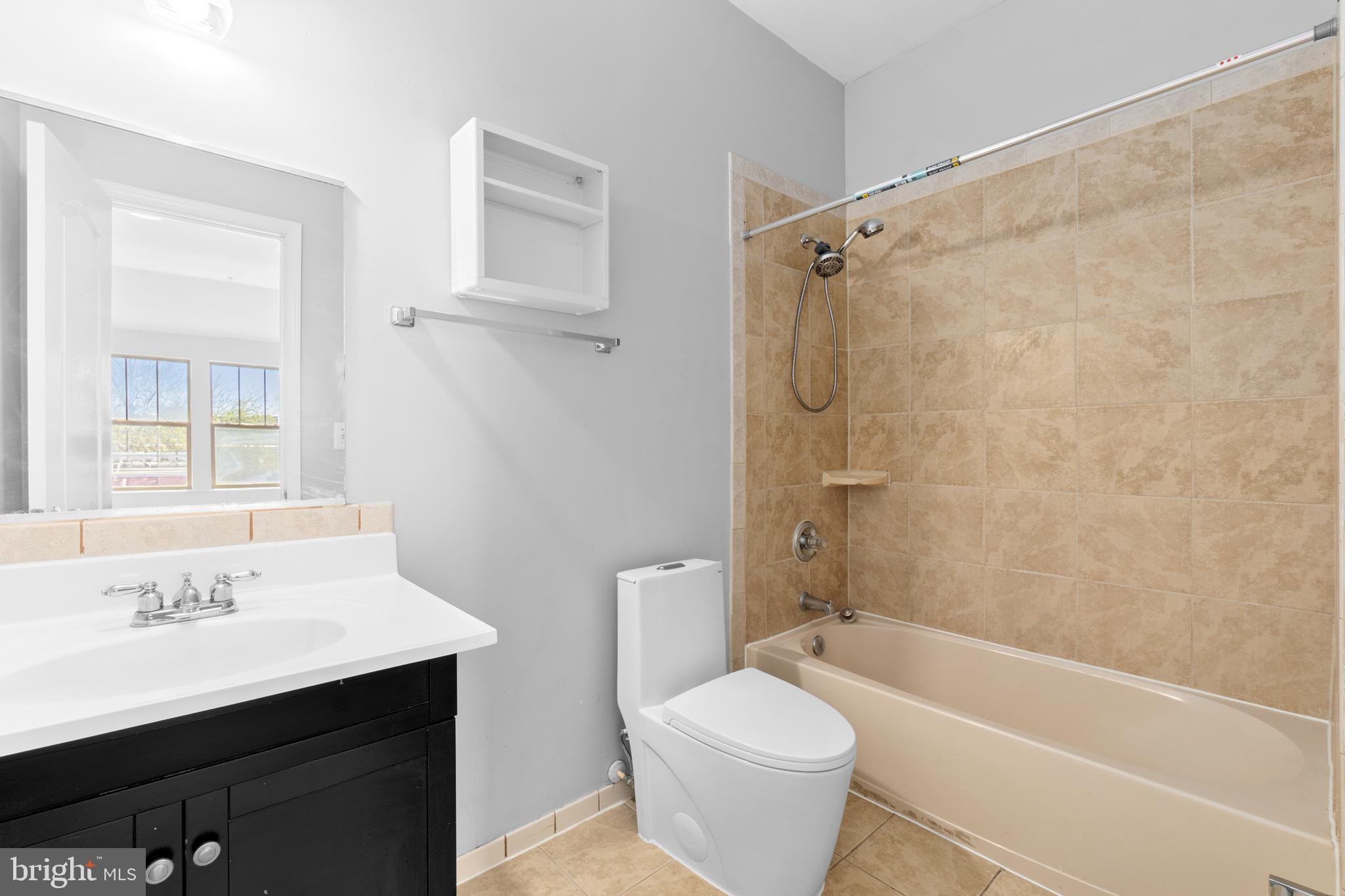 1829 Providence Street Northeast, Unit A Washington, DC 20002 - Photo 28 of 38 a bathroom with a sink a toilet and a bathtub