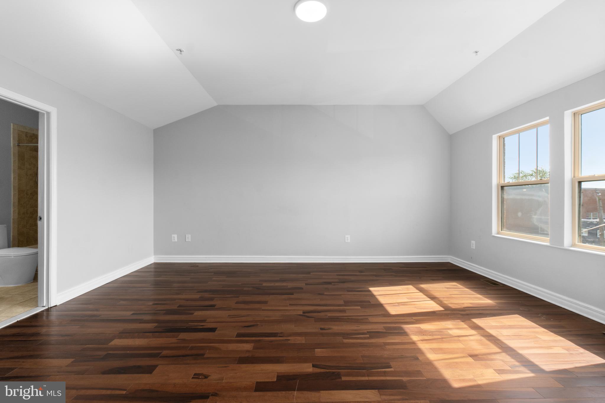 1829 Providence Street Northeast, Unit A Washington, DC 20002 - Photo 29 of 38 a view of an empty room with wooden floor and a window