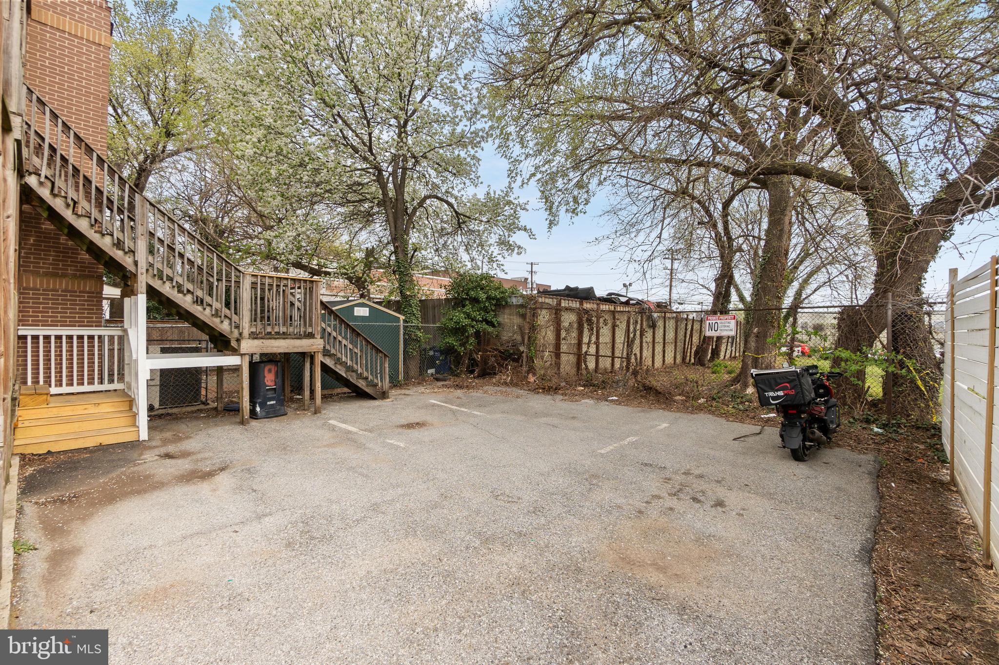 1829 Providence Street Northeast, Unit A Washington, DC 20002 - Photo 35 of 38 a view of a house with a yard covered in snow