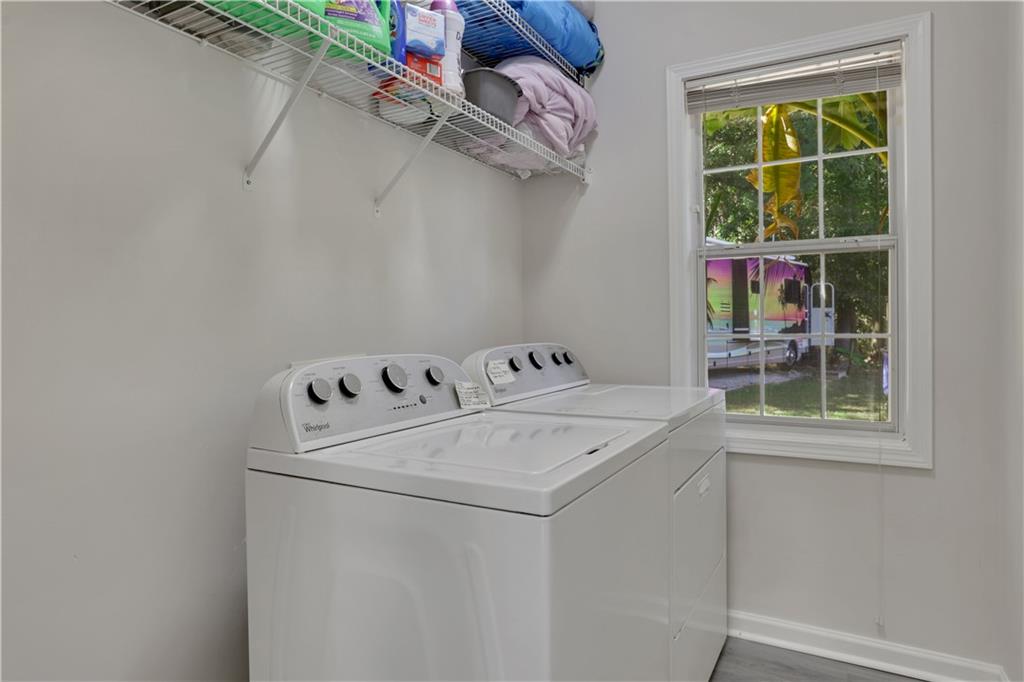 2760 Jona Trail Dacula, GA 30019 - Photo 20 of 40 a utility room with dryer and washer