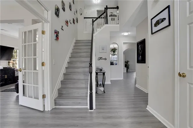 a view of entryway with furniture and wooden floor