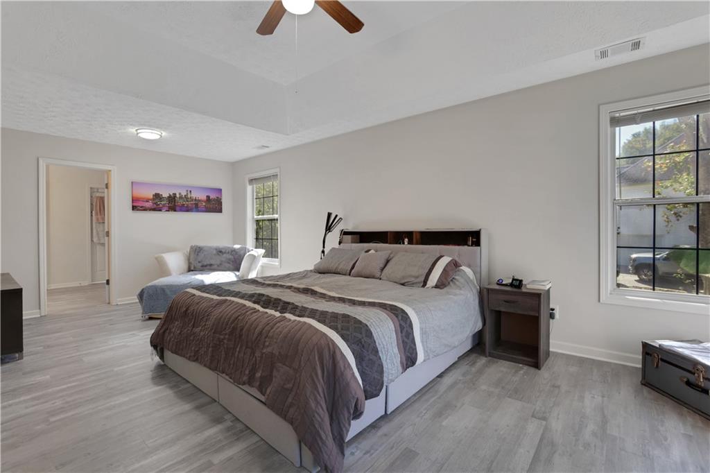 2760 Jona Trail Dacula, GA 30019 - Photo 22 of 40 a bedroom with a bed and a window