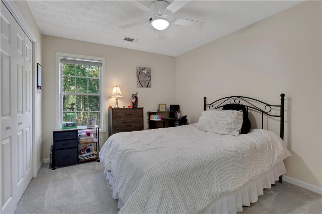 2760 Jona Trail Dacula, GA 30019 - Photo 30 of 40 a bedroom with bed and window