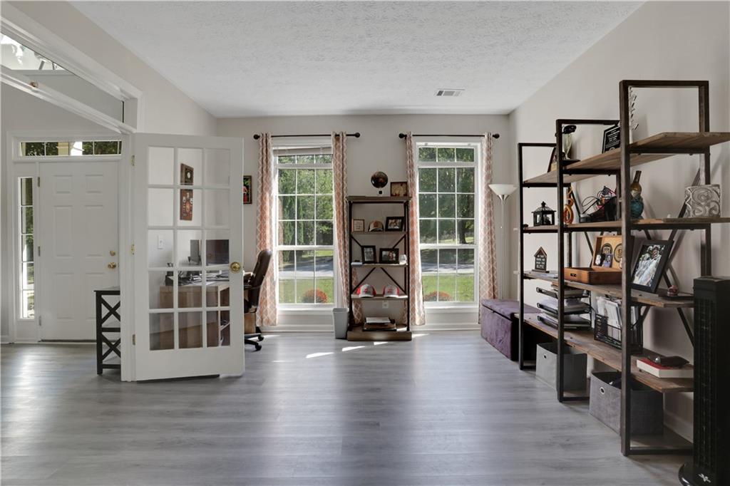 2760 Jona Trail Dacula, GA 30019 - Photo 4 of 40 a view of a livingroom with furniture and an empty room
