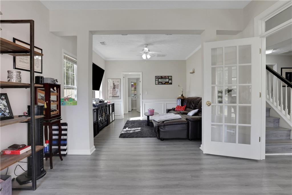 2760 Jona Trail Dacula, GA 30019 - Photo 5 of 40 a living room with furniture and a flat screen tv