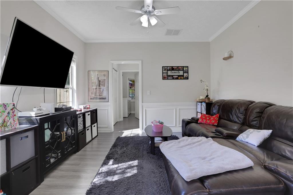 2760 Jona Trail Dacula, GA 30019 - Photo 6 of 40 a living room with furniture and a flat screen tv