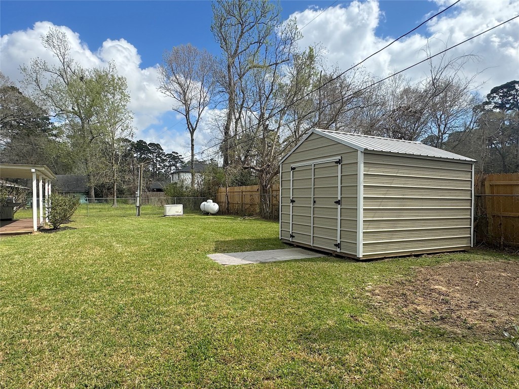 25827 Water Ridge Drive Huffman, TX 77336 - Photo 11 of 22 a view of a house with a yard