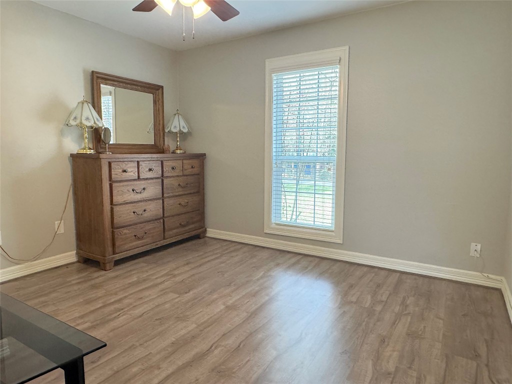 25827 Water Ridge Drive Huffman, TX 77336 - Photo 12 of 22 a room with a dresser and a window