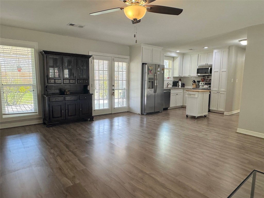 25827 Water Ridge Drive Huffman, TX 77336 - Photo 2 of 22 a view of a kitchen with stove and wooden floor