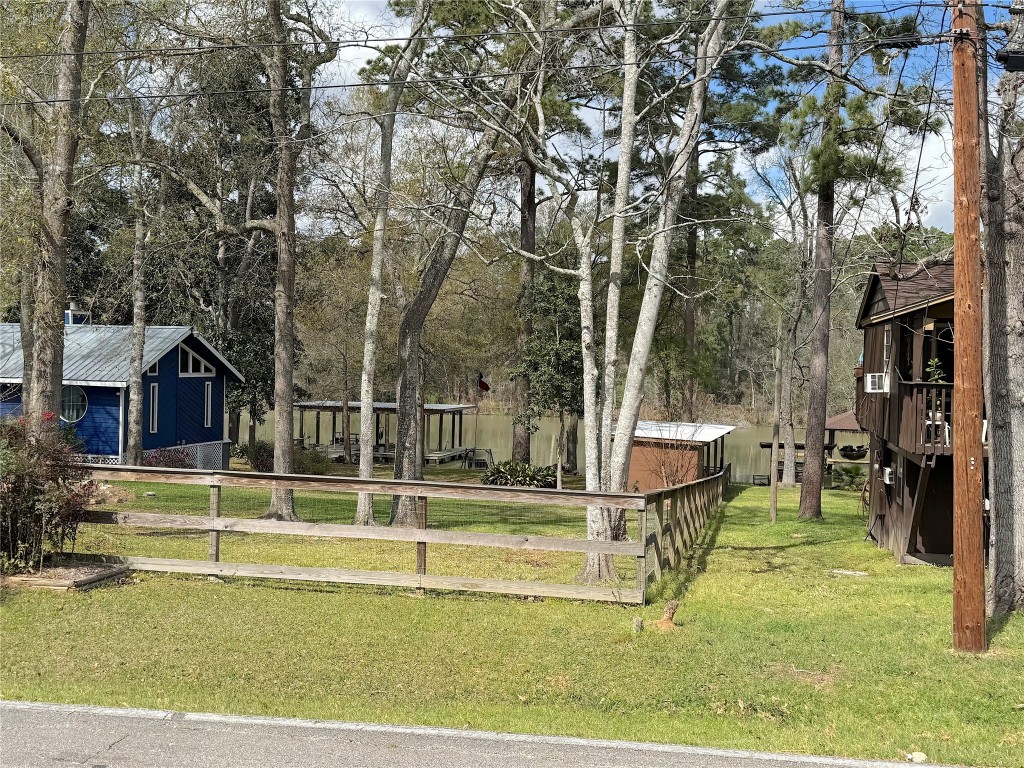 25827 Water Ridge Drive Huffman, TX 77336 - Photo 22 of 22 a view of a house with backyard and sitting area