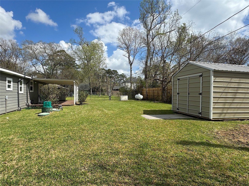 25827 Water Ridge Drive Huffman, TX 77336 - Photo 6 of 22 a view of a house with yard and a tree