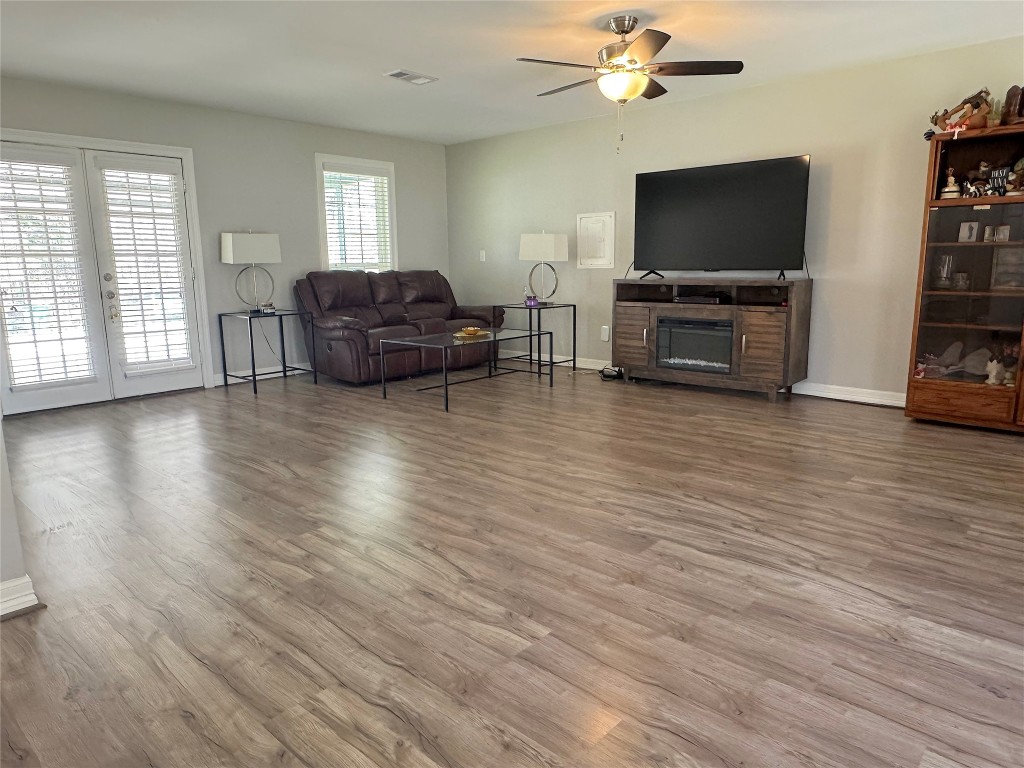 25827 Water Ridge Drive Huffman, TX 77336 - Photo 8 of 22 a living room with furniture and a flat screen tv
