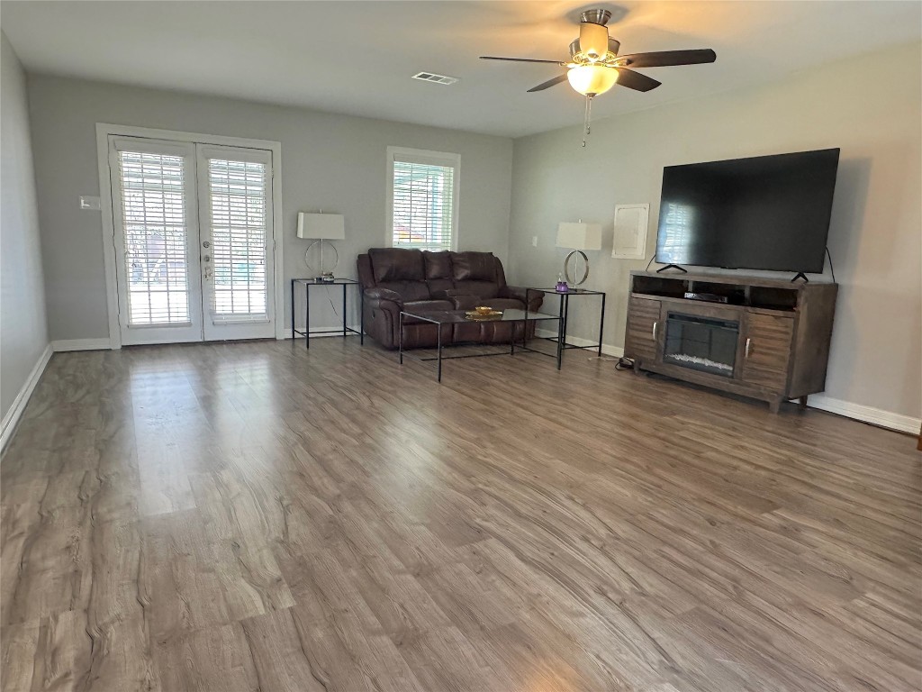 25827 Water Ridge Drive Huffman, TX 77336 - Photo 9 of 22 a living room with furniture and a flat screen tv
