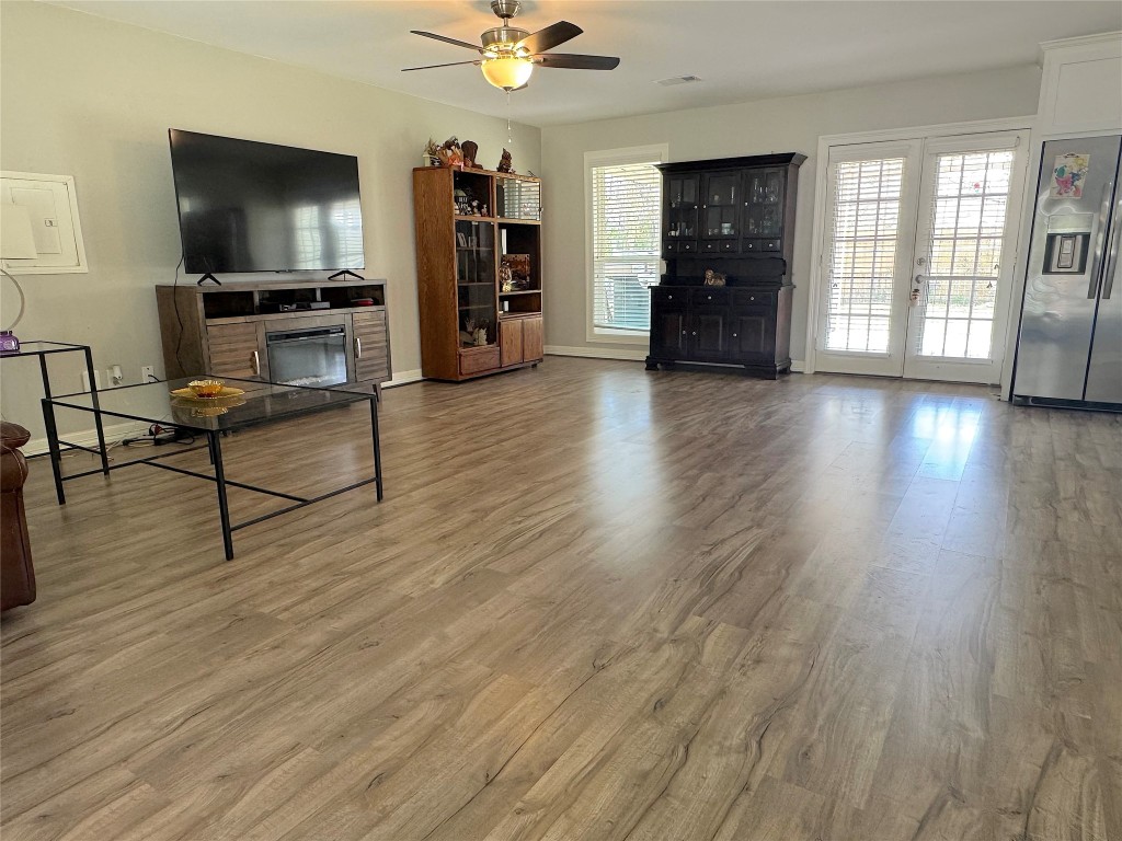 25827 Water Ridge Drive Huffman, TX 77336 - Photo 10 of 22 a living room with furniture and a flat screen tv