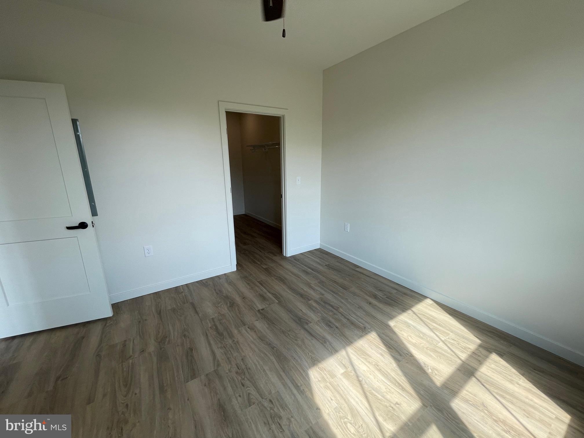 15 Kennedy Street Lancaster, PA 17602 - Photo 13 of 17 an empty room with wooden floor and windows
