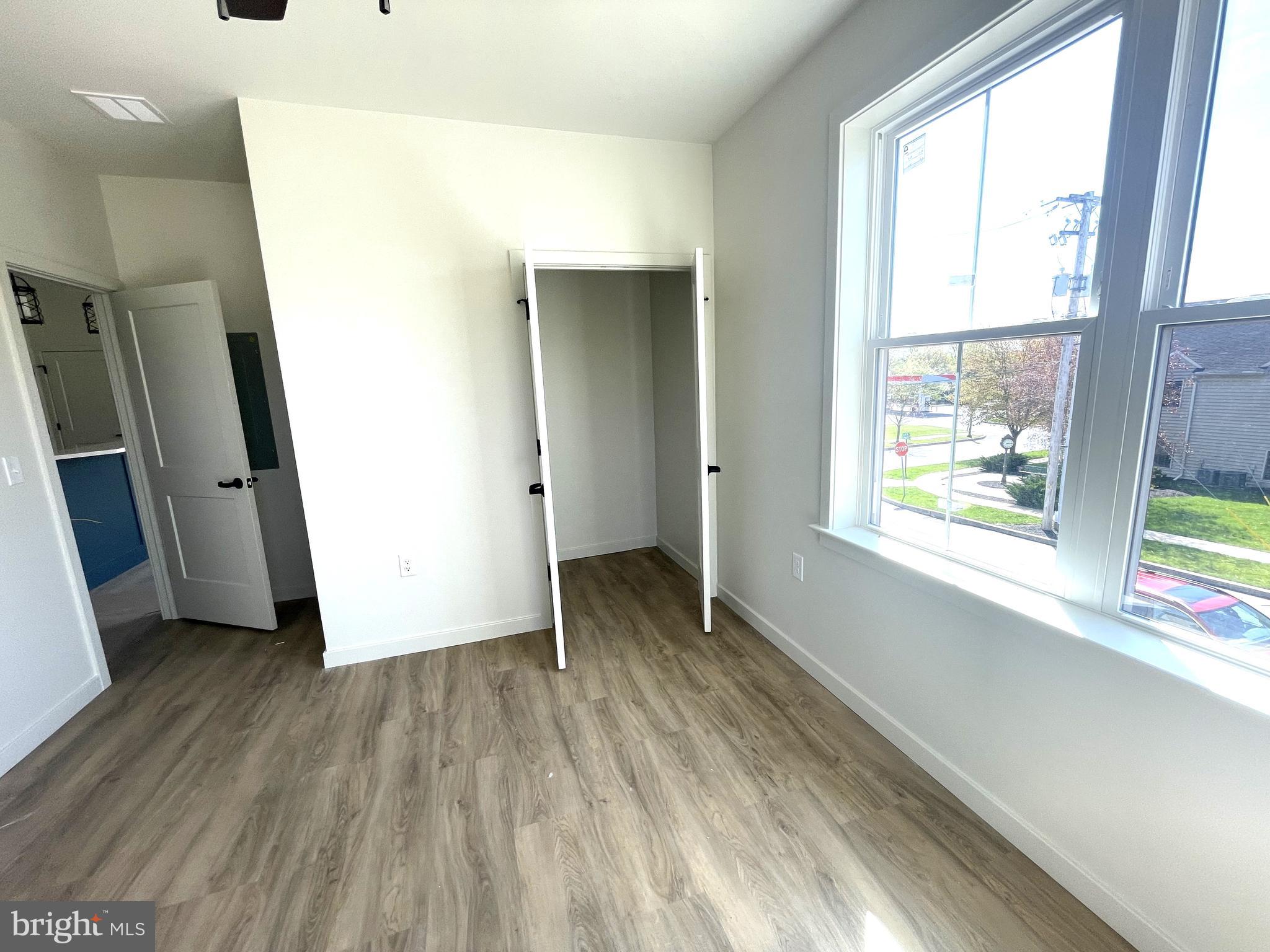 15 Kennedy Street Lancaster, PA 17602 - Photo 7 of 17 a view of hallway with a large window and wooden floor
