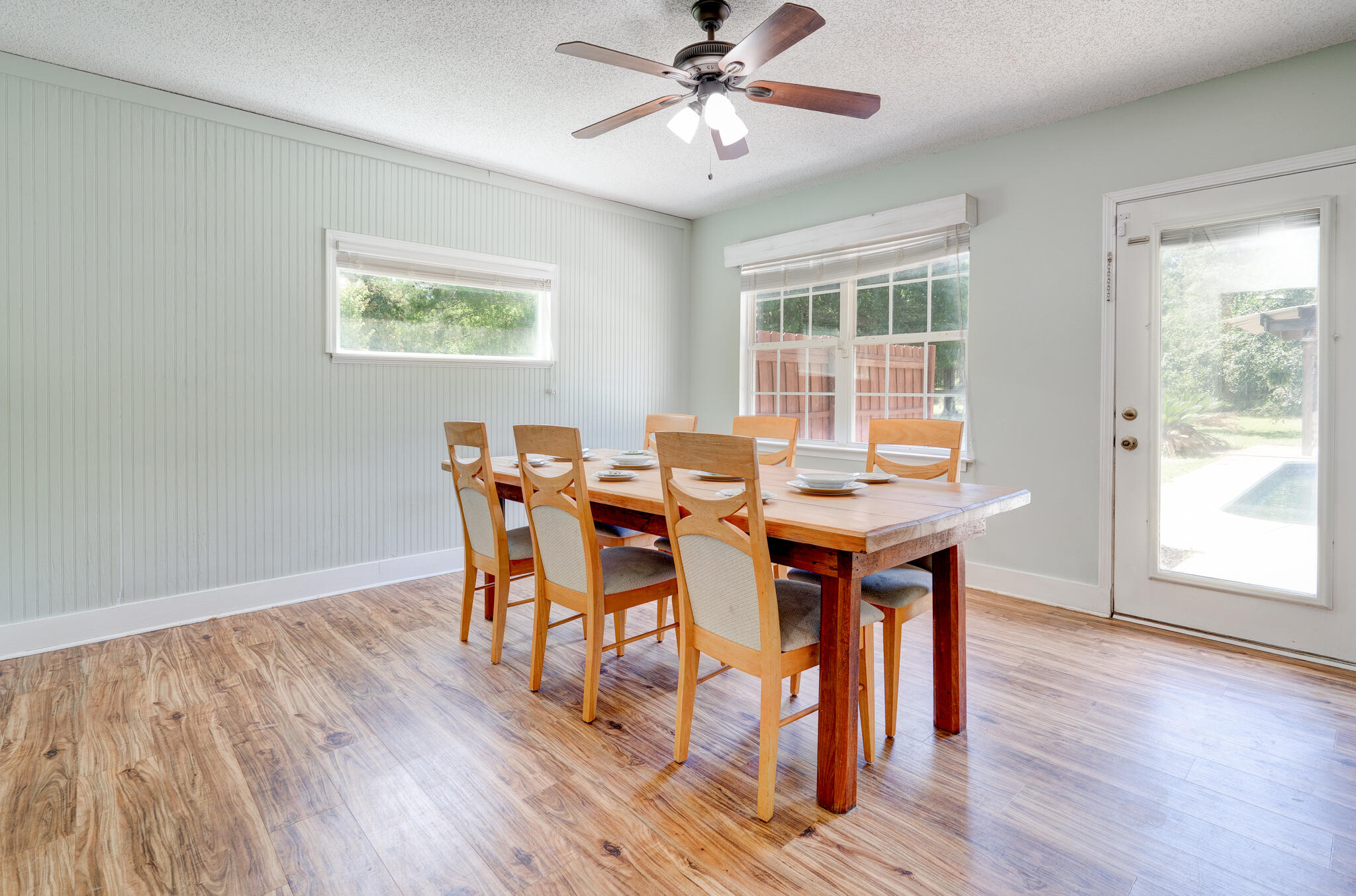 4236 Edge Perry Road Crestview, FL 32539 - Photo 11 of 51 a view of a dining room with furniture and wooden floor