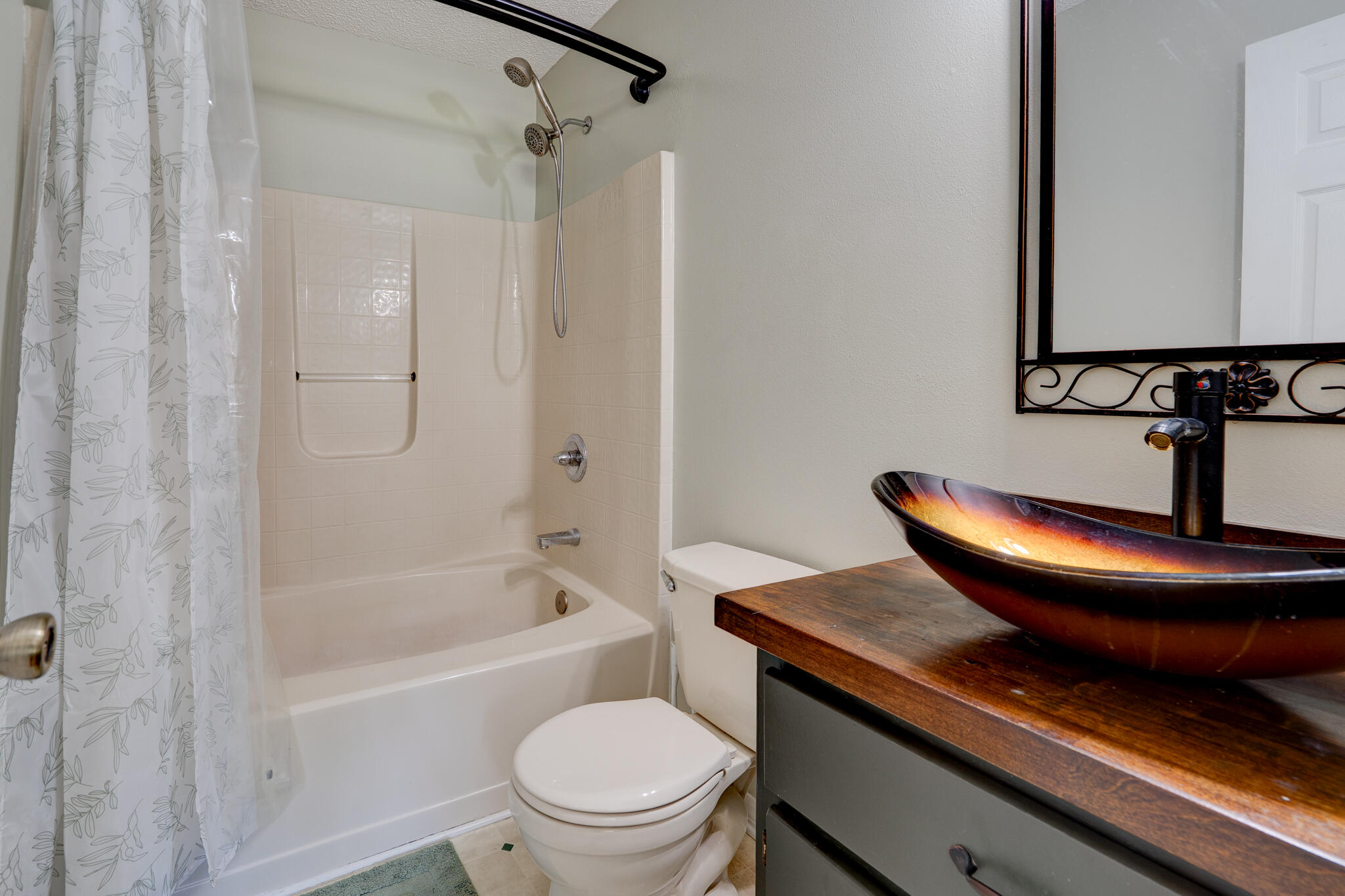 4236 Edge Perry Road Crestview, FL 32539 - Photo 18 of 51 a bathroom with a sink a toilet a mirror and shower