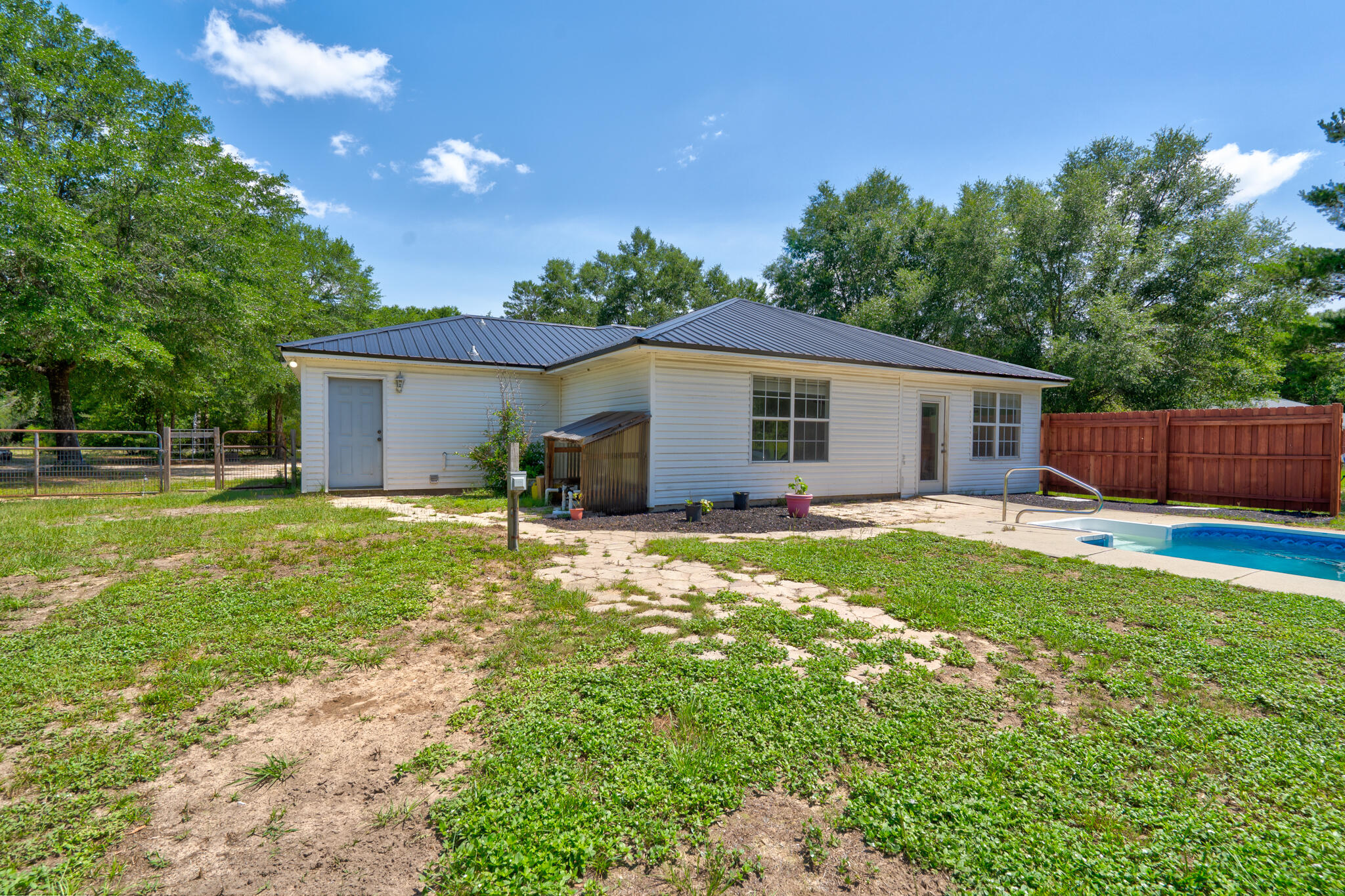 4236 Edge Perry Road Crestview, FL 32539 - Photo 23 of 51 a view of a house with backyard and sitting area