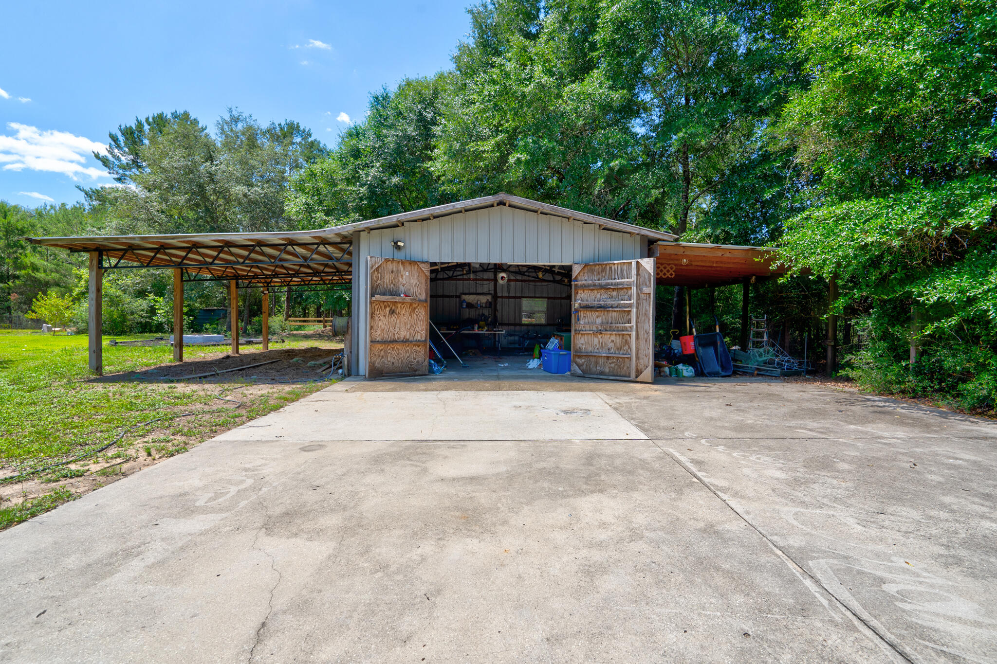 4236 Edge Perry Road Crestview, FL 32539 - Photo 26 of 51 a view of a house with backyard and trees
