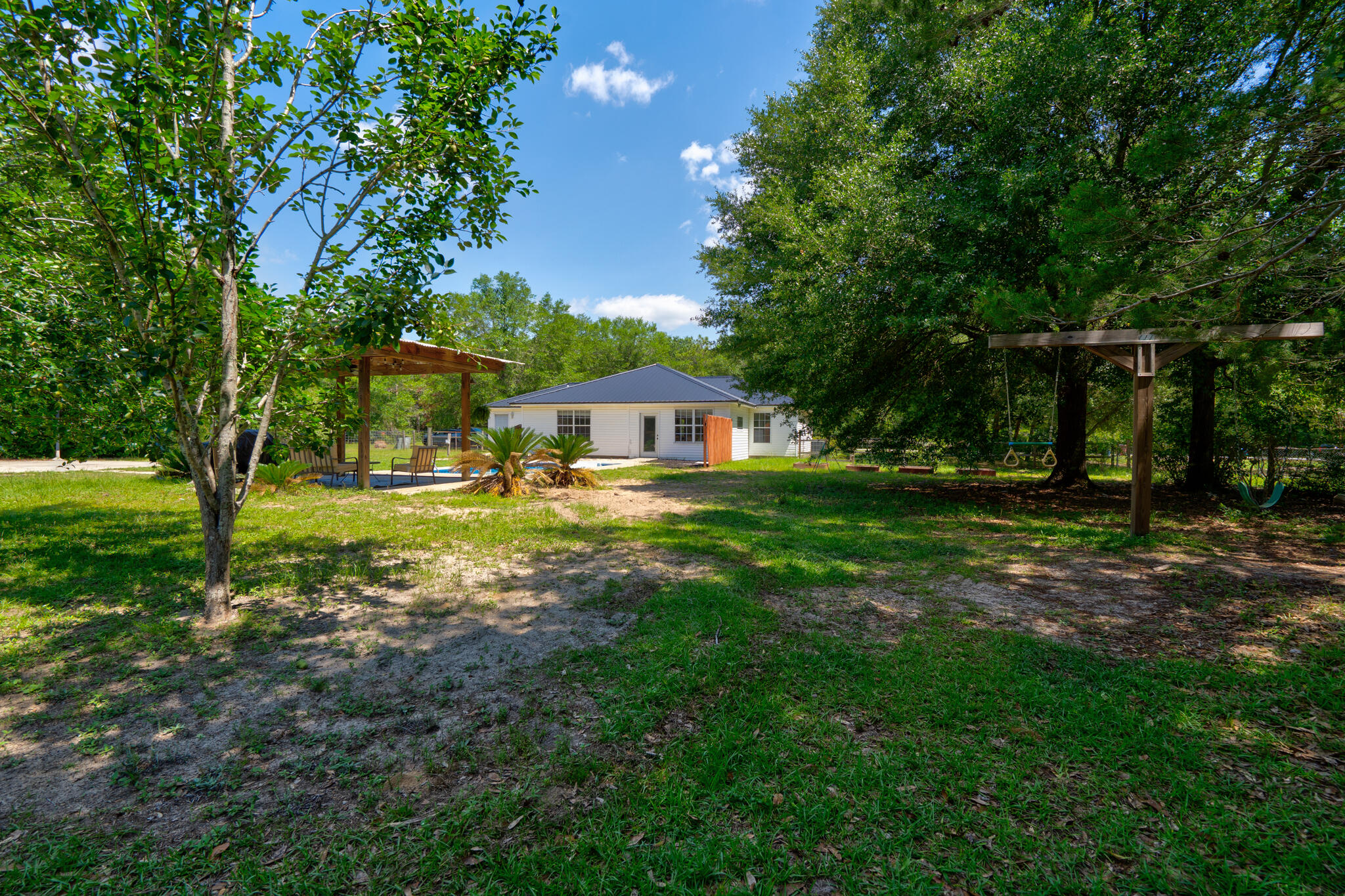 4236 Edge Perry Road Crestview, FL 32539 - Photo 28 of 51 a front view of a house with garden