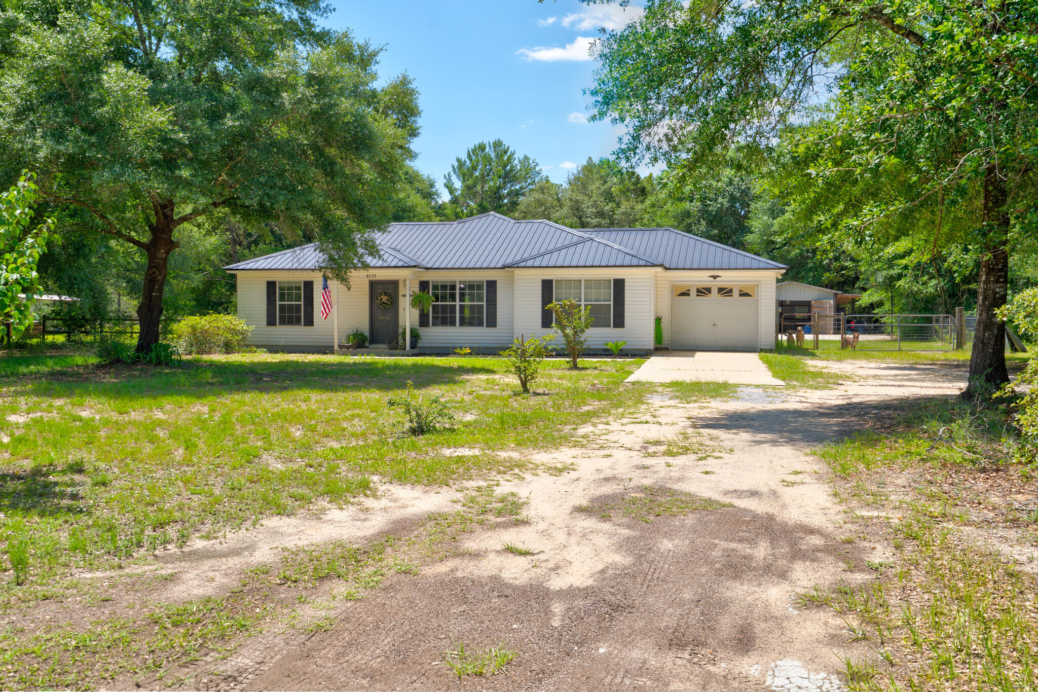 4236 Edge Perry Road Crestview, FL 32539 - Photo 34 of 51 a front view of a house with garden