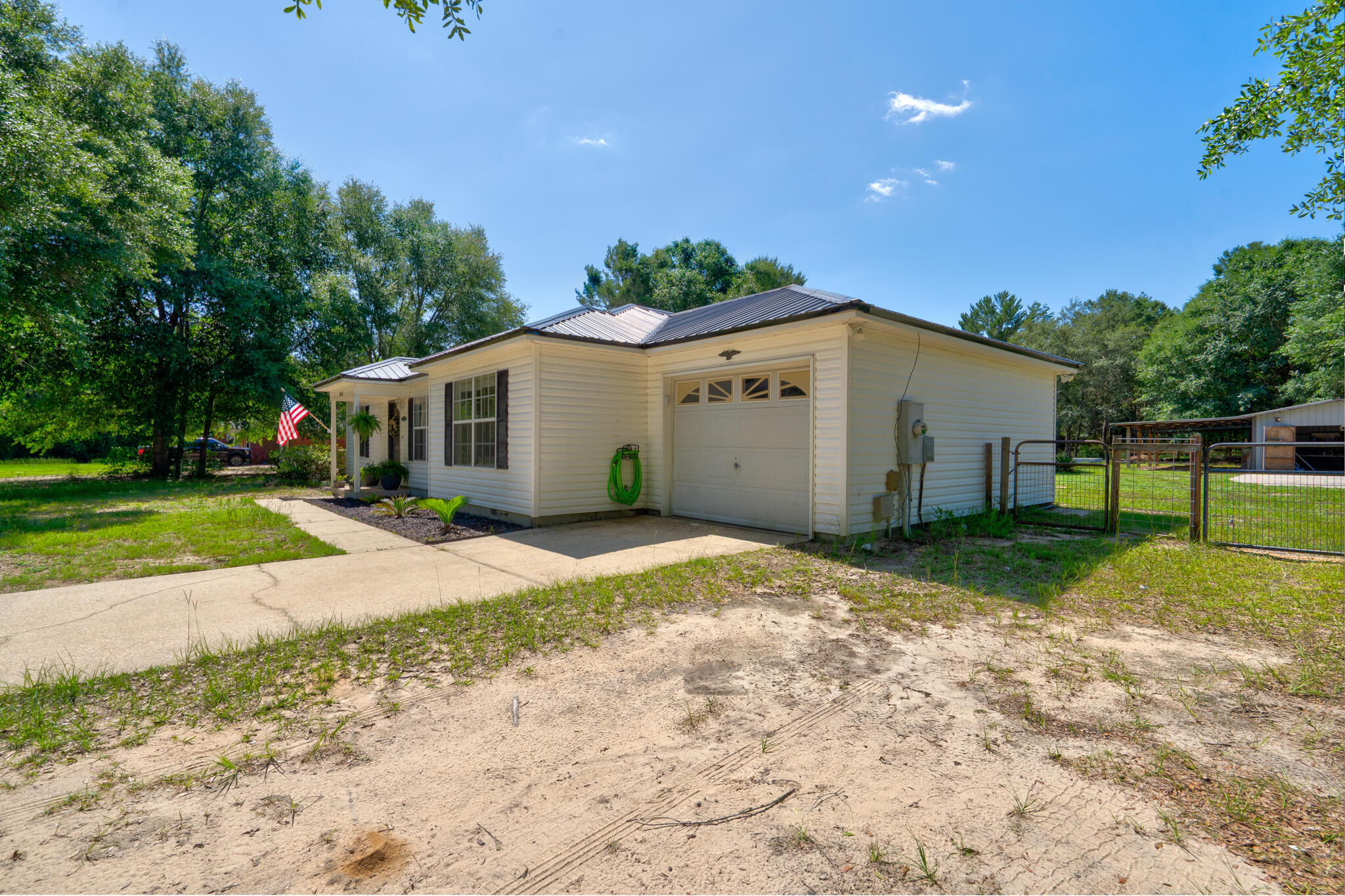 4236 Edge Perry Road Crestview, FL 32539 - Photo 35 of 51 a view of a house with backyard and trees