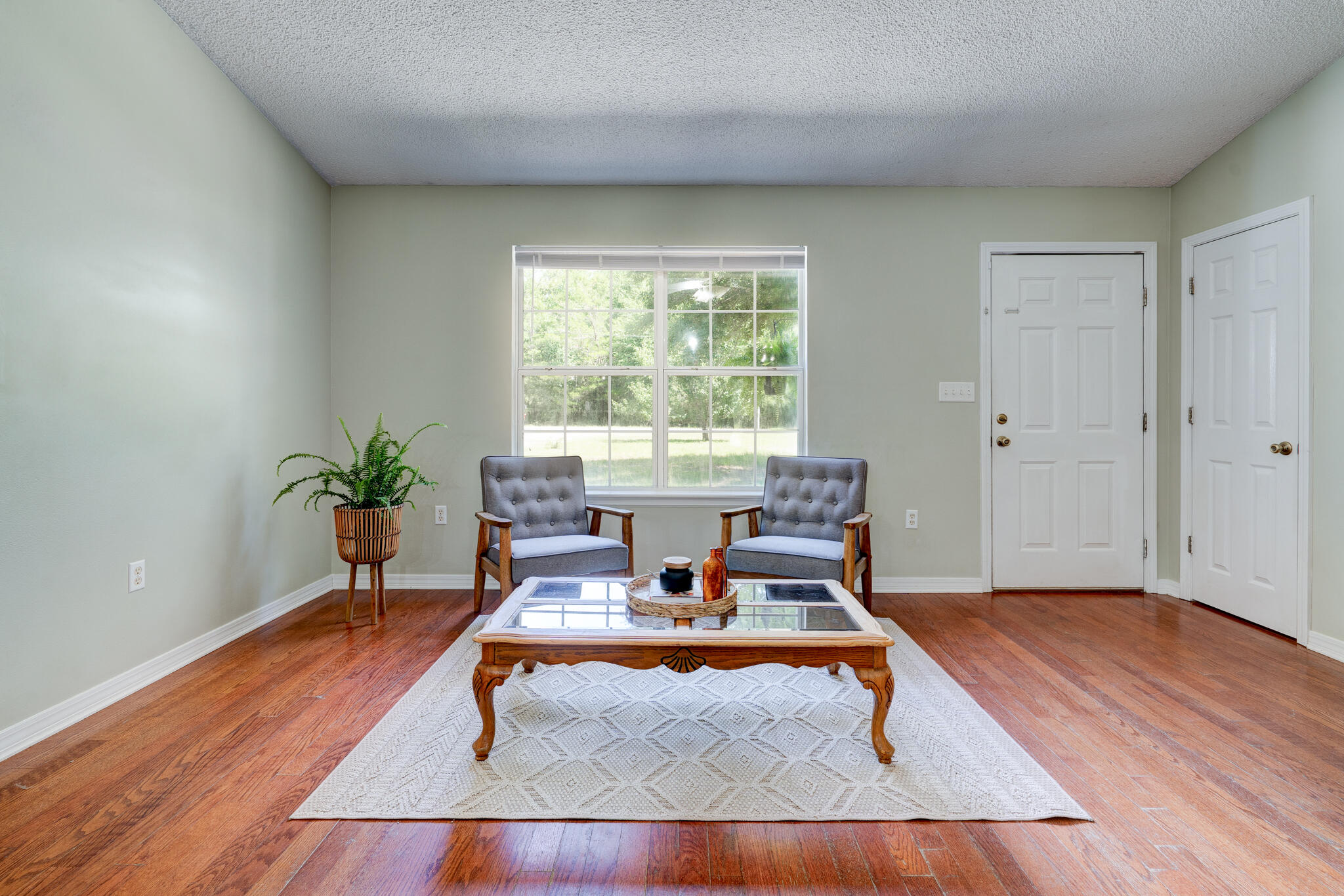 4236 Edge Perry Road Crestview, FL 32539 - Photo 4 of 51 a living room with furniture and a large window