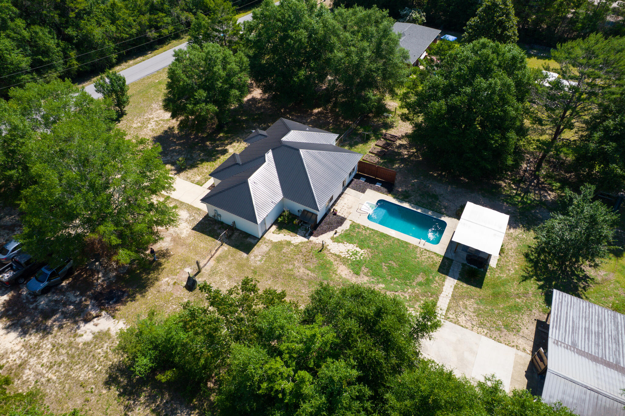 4236 Edge Perry Road Crestview, FL 32539 - Photo 44 of 51 an aerial view of a house with garden space and street view