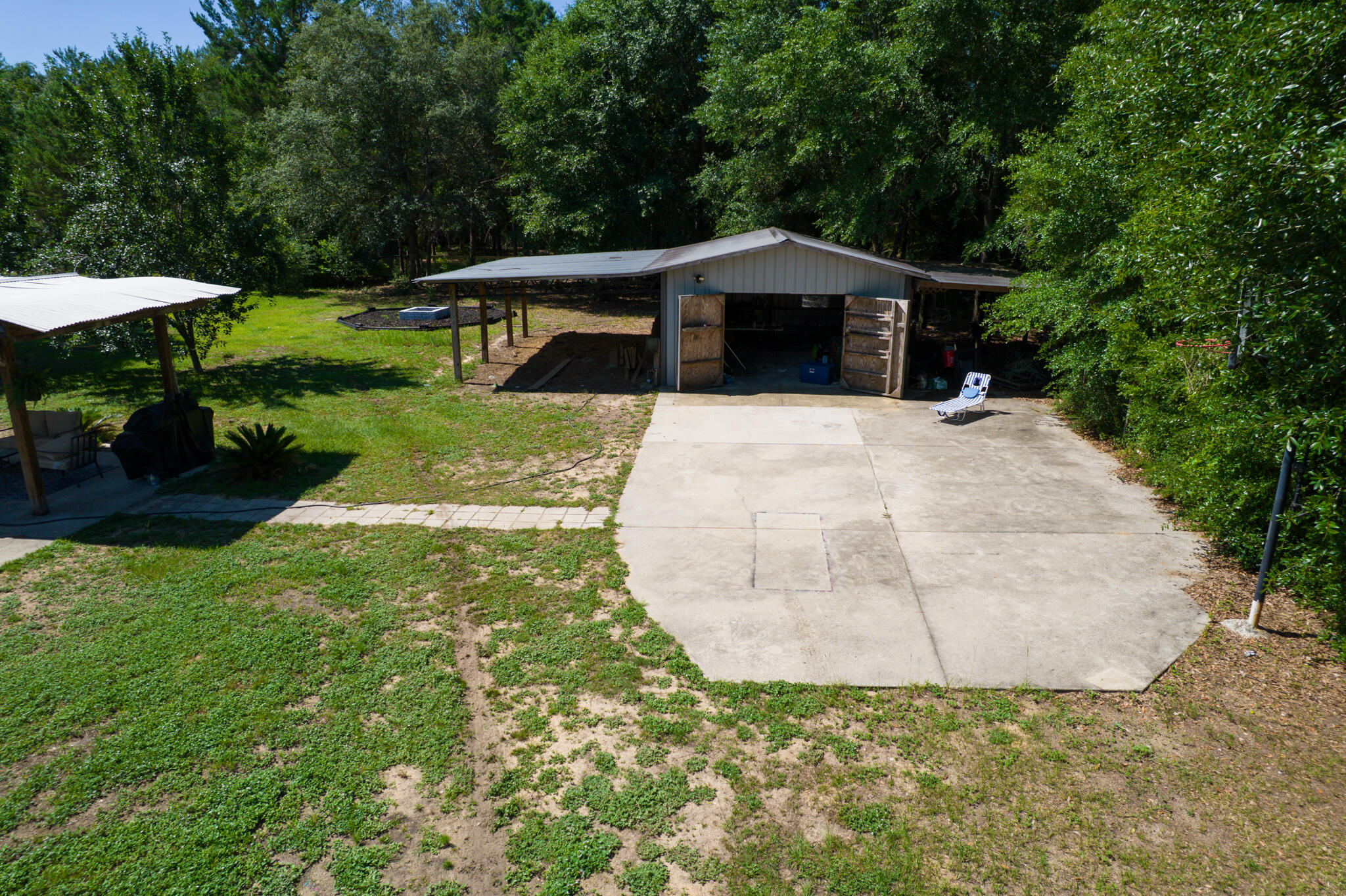 4236 Edge Perry Road Crestview, FL 32539 - Photo 48 of 51 a house with green field in front of it