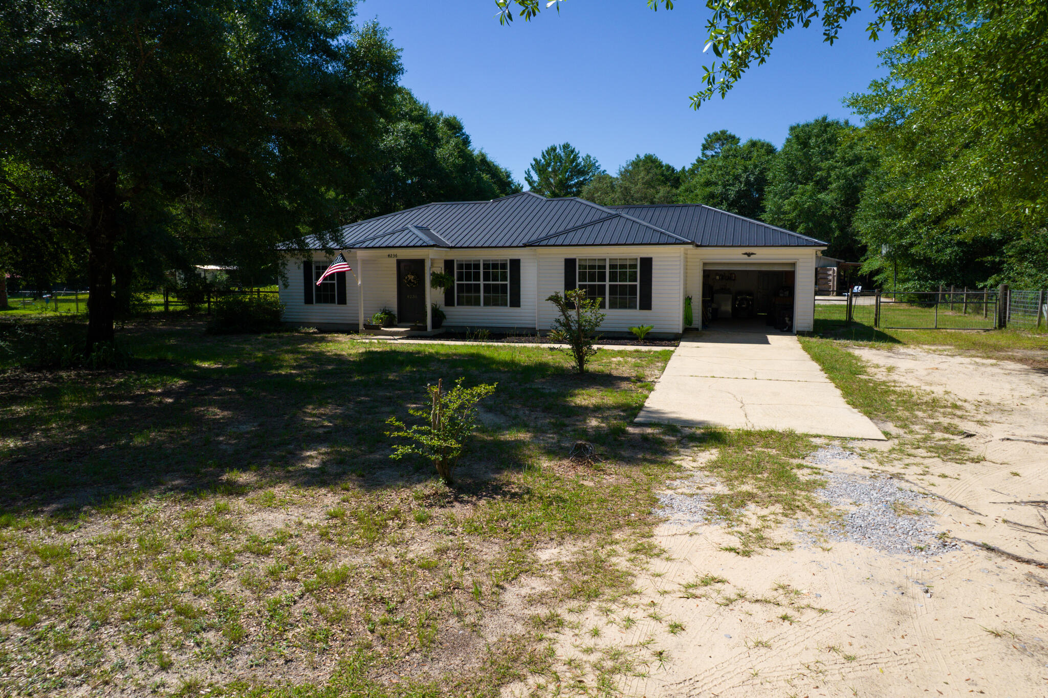 4236 Edge Perry Road Crestview, FL 32539 - Photo 50 of 51 a front view of a house with a yard