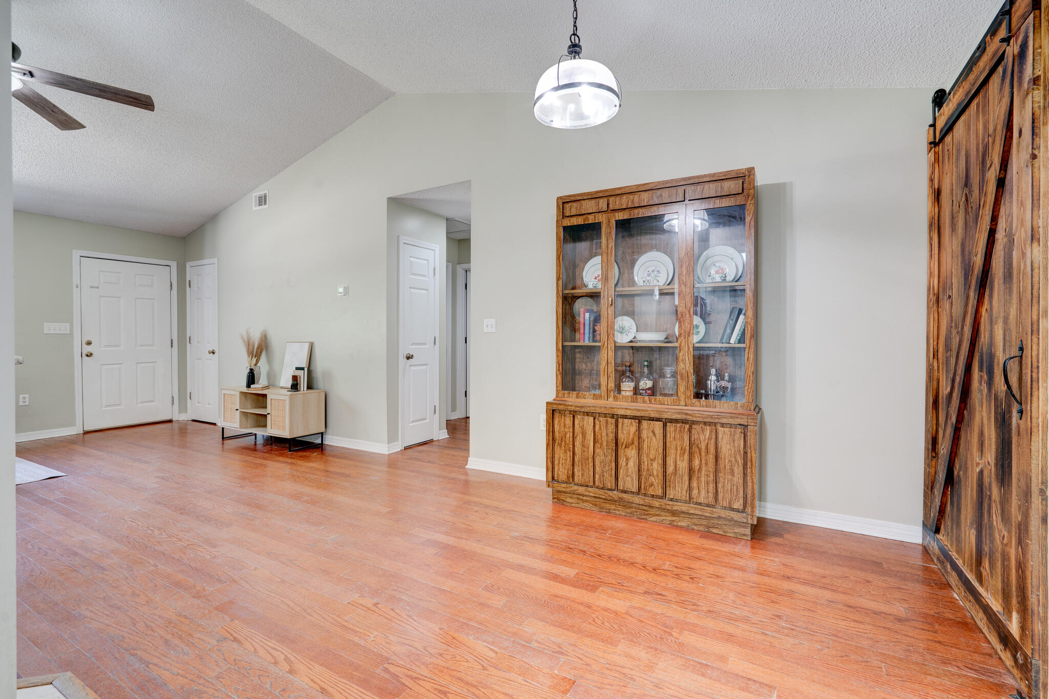 4236 Edge Perry Road Crestview, FL 32539 - Photo 5 of 51 a view of an empty room with a window and wooden floor