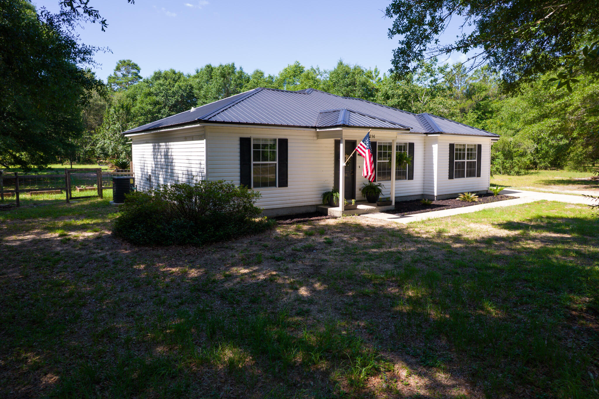 4236 Edge Perry Road Crestview, FL 32539 - Photo 51 of 51 a view of a house with garden