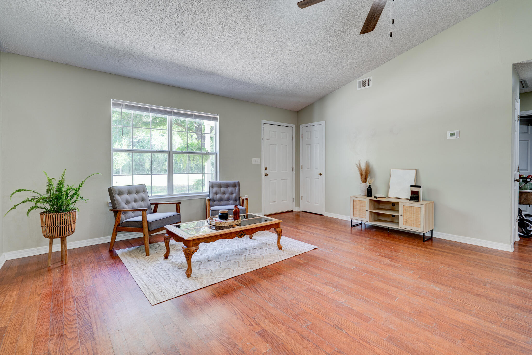4236 Edge Perry Road Crestview, FL 32539 - Photo 6 of 51 a living room with furniture and wooden floor