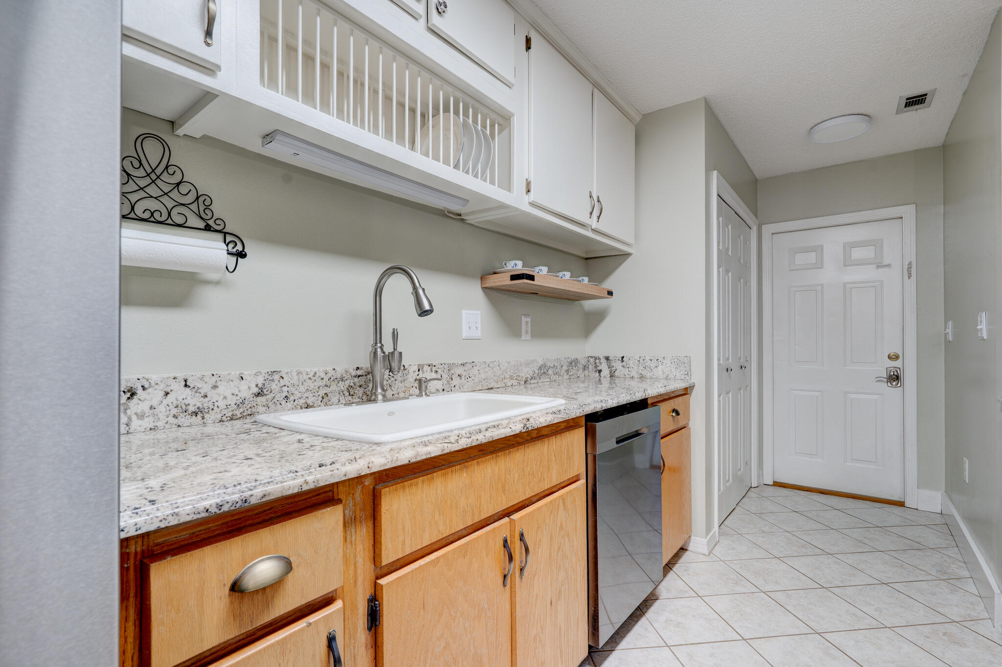 4236 Edge Perry Road Crestview, FL 32539 - Photo 7 of 51 a kitchen with granite countertop a sink and cabinets