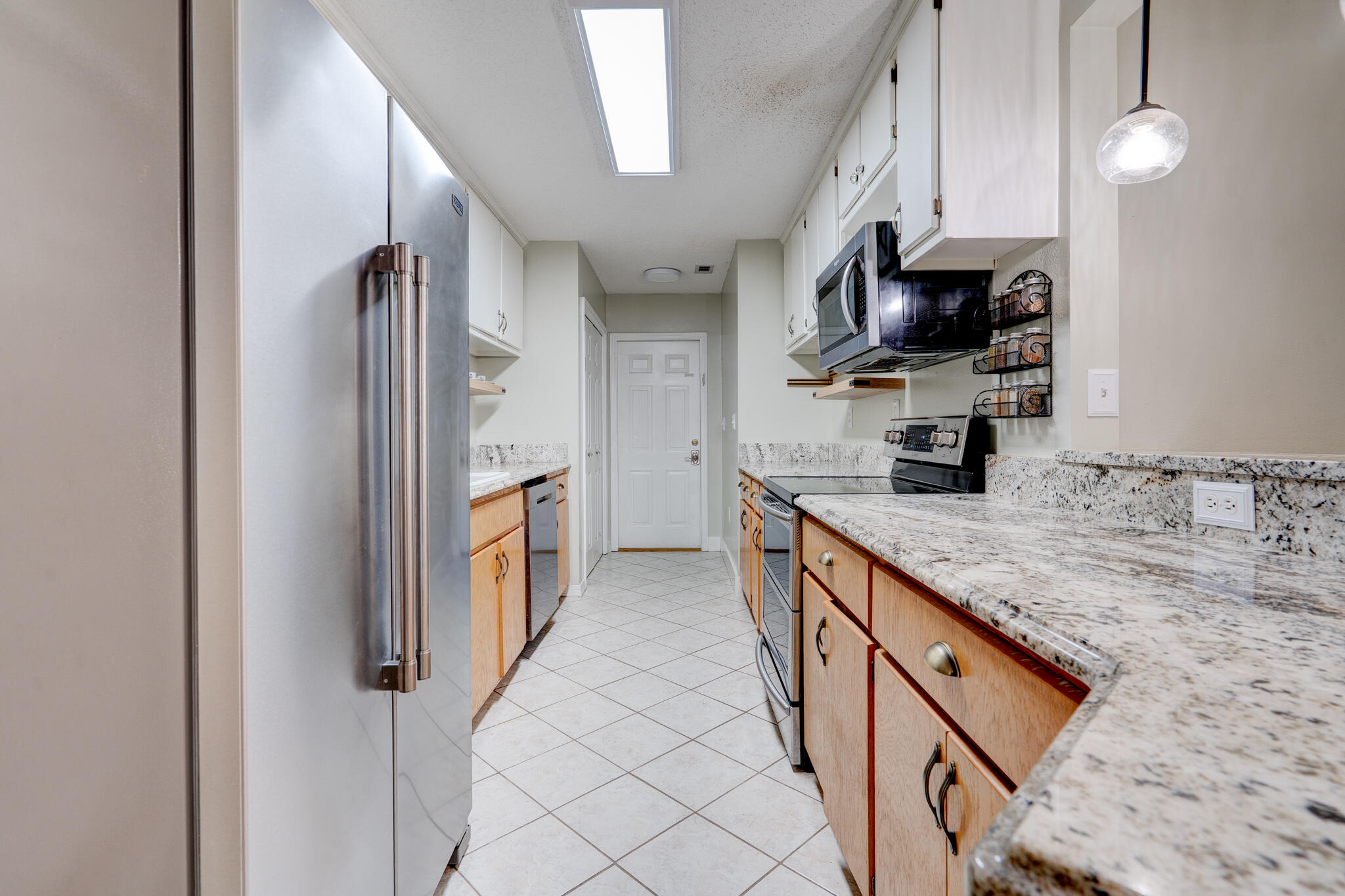 4236 Edge Perry Road Crestview, FL 32539 - Photo 8 of 51 a kitchen with stainless steel appliances granite countertop a refrigerator a sink and a stove
