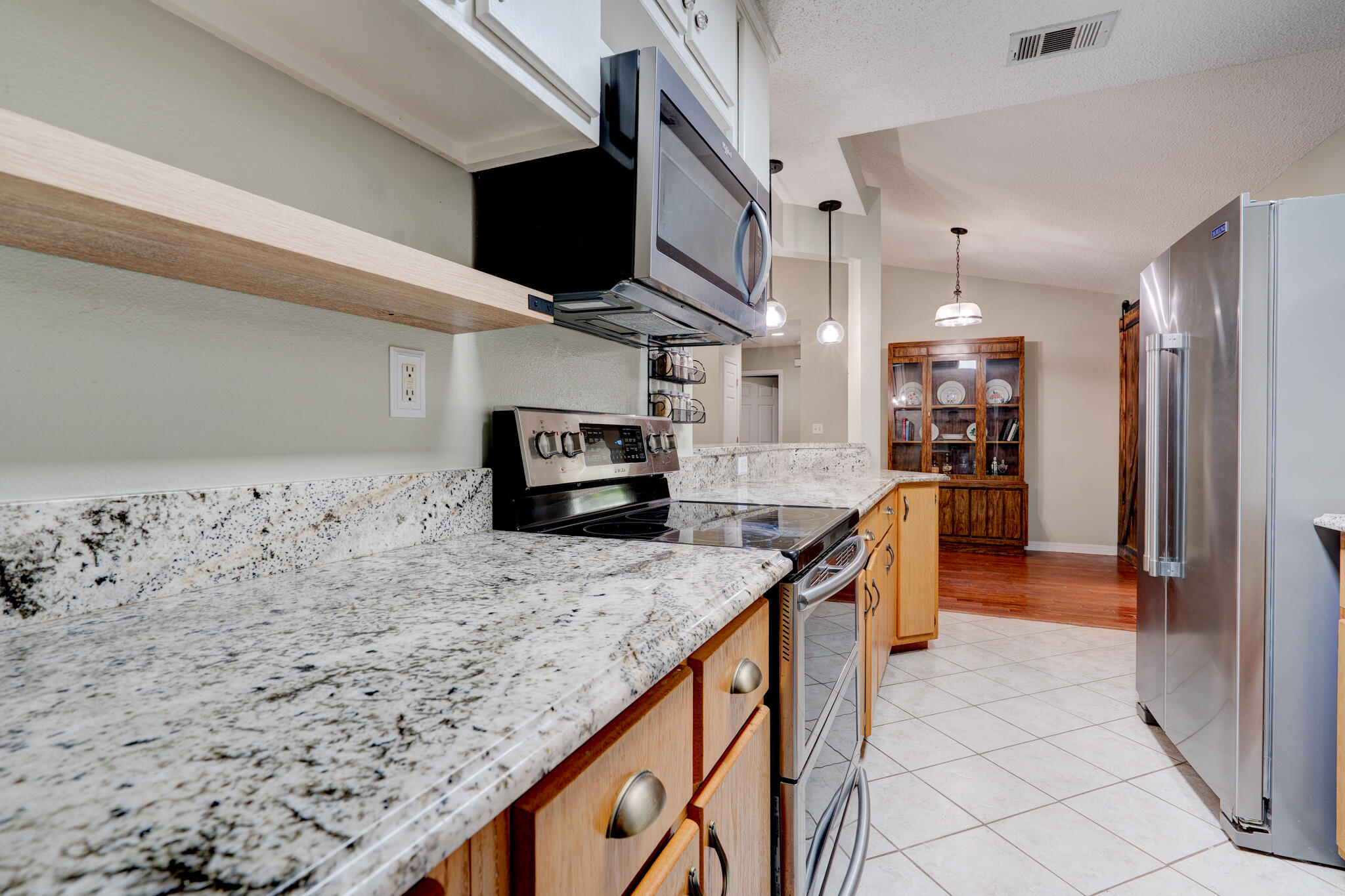 4236 Edge Perry Road Crestview, FL 32539 - Photo 9 of 51 a kitchen with kitchen island sink stove and refrigerator