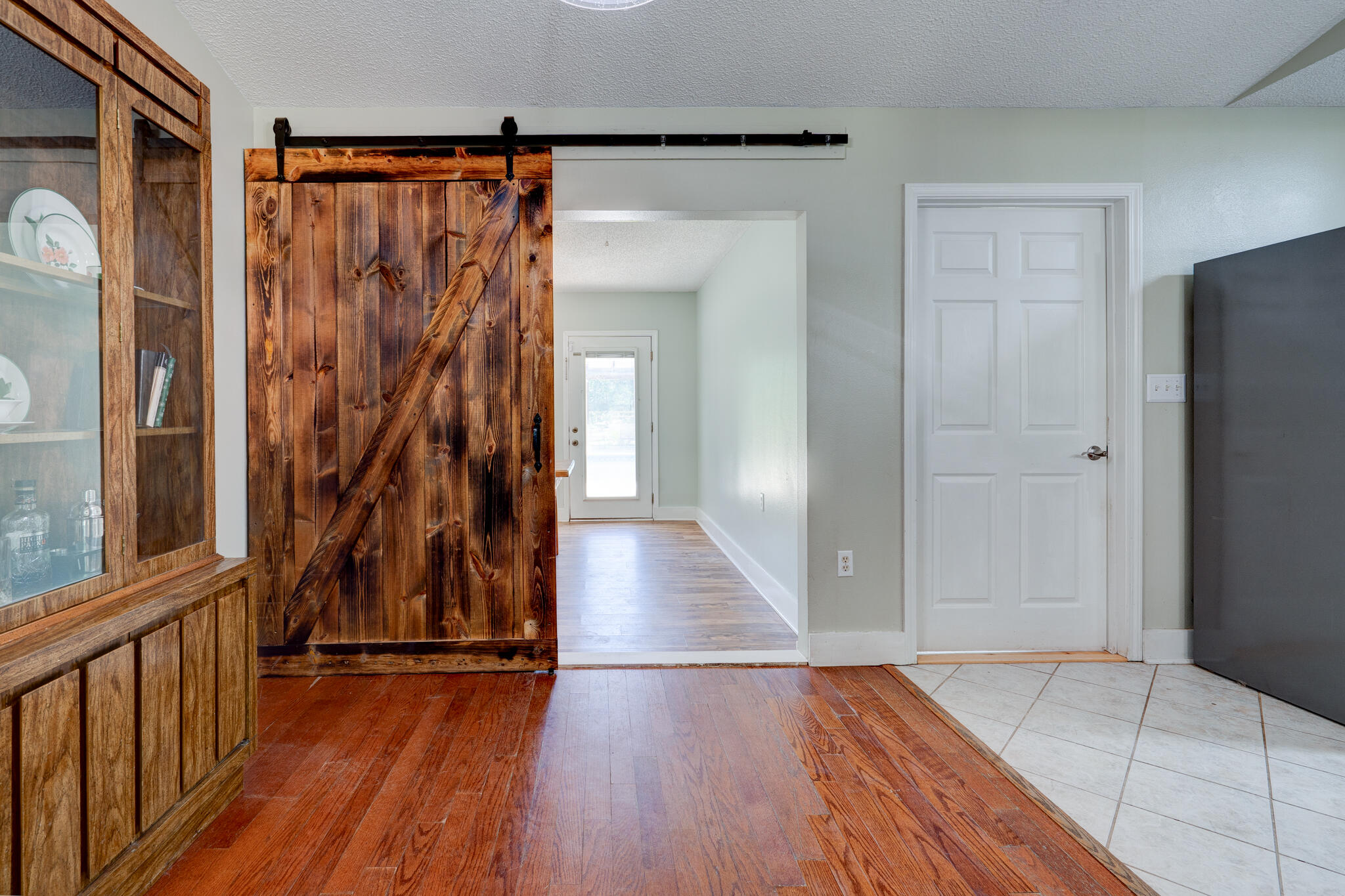 4236 Edge Perry Road Crestview, FL 32539 - Photo 10 of 51 a view of a room with wooden floor and stairs