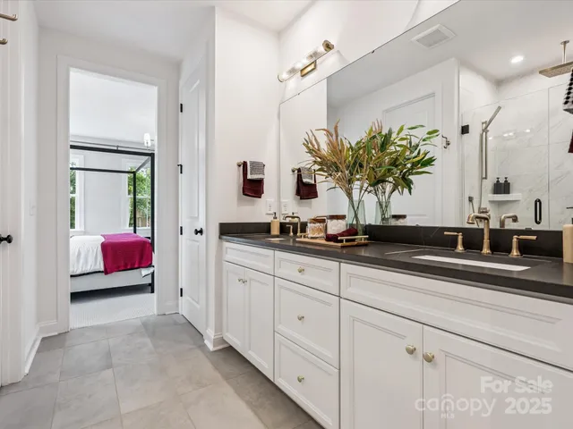 a kitchen with sink and cabinets